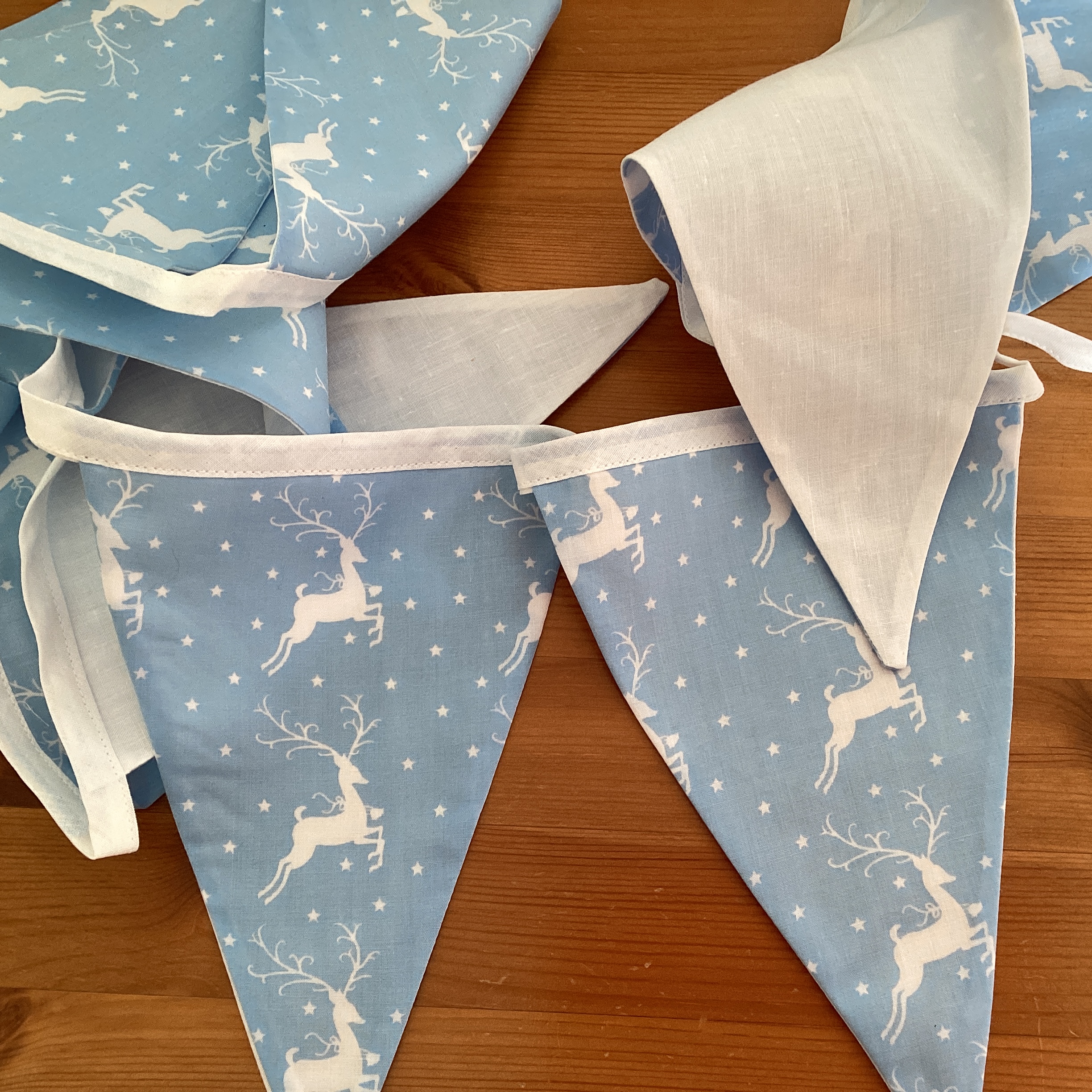 Christmas Bunting - white deer on pale blue